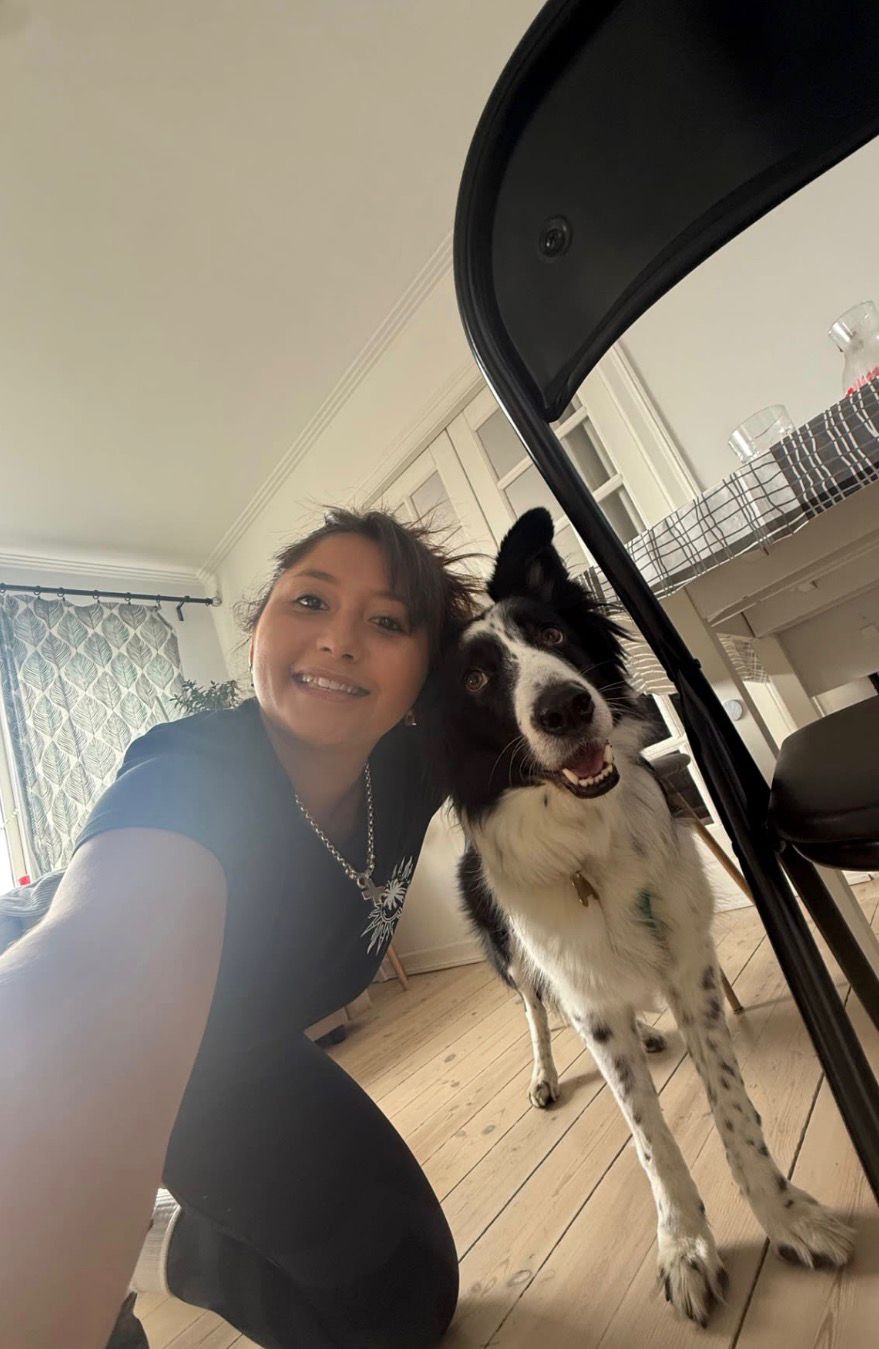 Selfie of Sofia with a friendly border collie